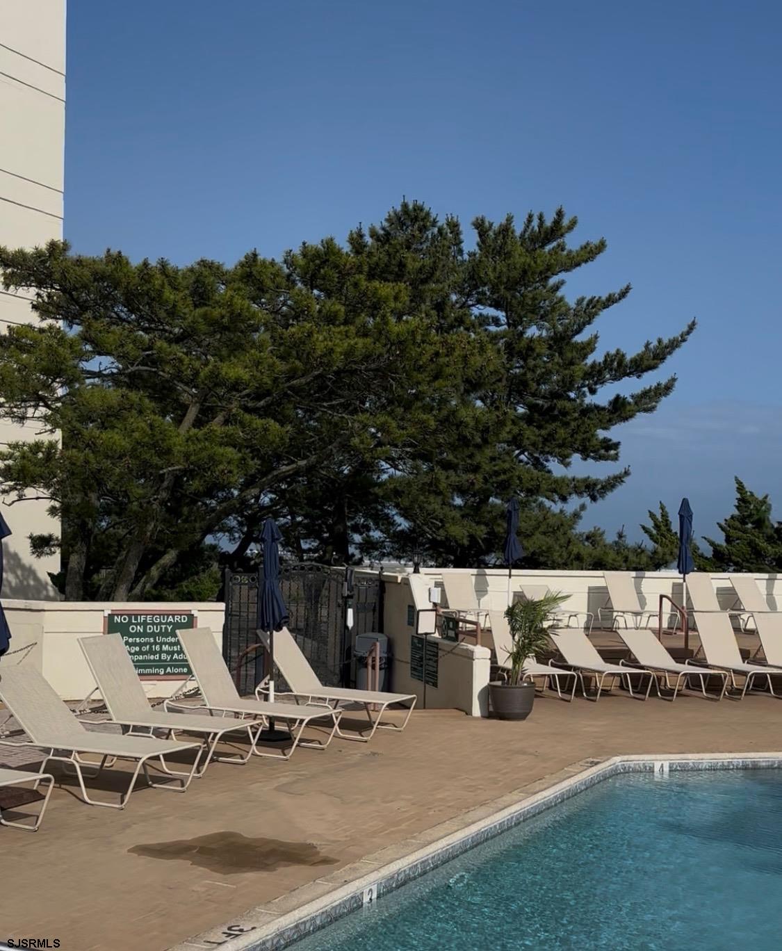 3851 Boardwalk, Unit 1405 Atlantic City, NJ 08401 - Photo 34 of 36 a view of outdoor space with seating area and trees around