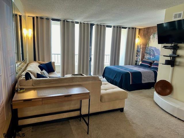 3851 Boardwalk, Unit 1405 Atlantic City, NJ 08401 - Photo 6 of 36 a bedroom with bed and large window