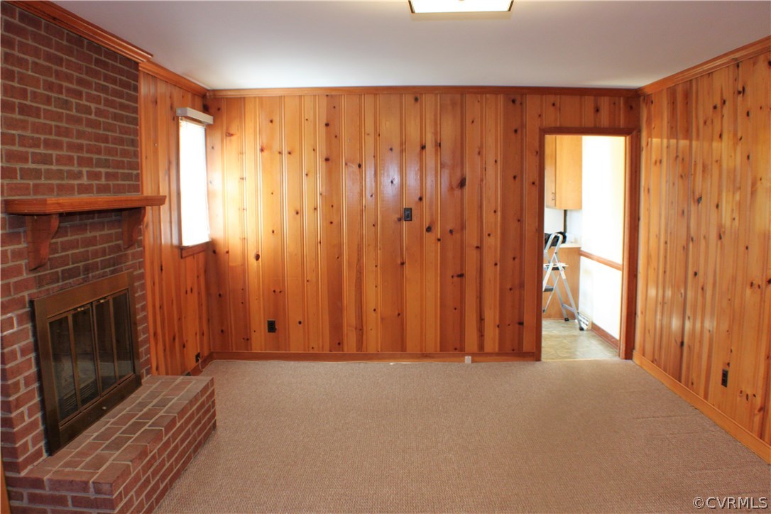 9931 Trebeck Road Chesterfield, VA 23236 - Photo 14 of 43 a view of an empty room with wooden floor and a fireplace