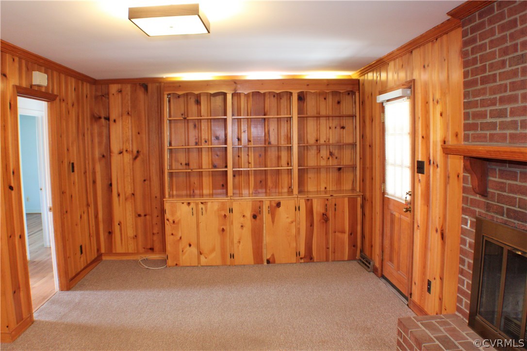 9931 Trebeck Road Chesterfield, VA 23236 - Photo 15 of 43 a view of an empty room with wooden floor and a fireplace