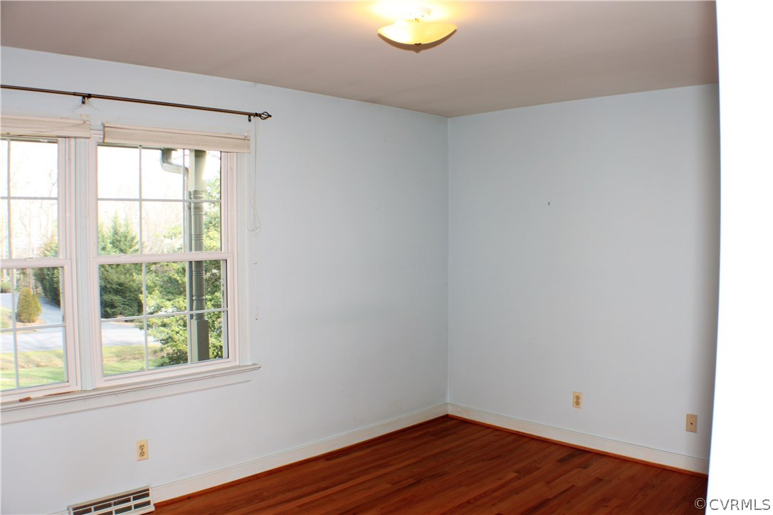 9931 Trebeck Road Chesterfield, VA 23236 - Photo 18 of 43 a view of a room that has wooden floor and a window