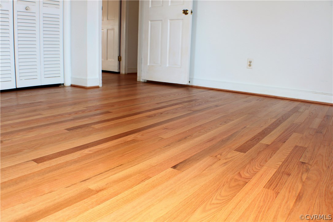 9931 Trebeck Road Chesterfield, VA 23236 - Photo 21 of 43 a view of a livingroom with wooden floor and stairs
