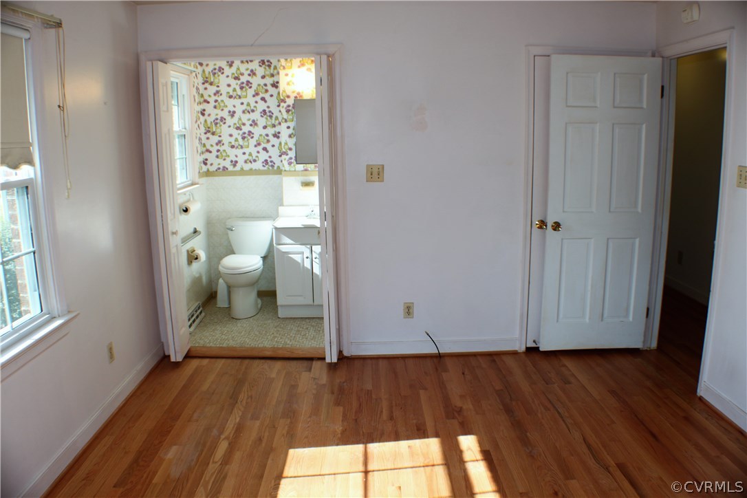 9931 Trebeck Road Chesterfield, VA 23236 - Photo 23 of 43 a view of a room with wooden floor and a window