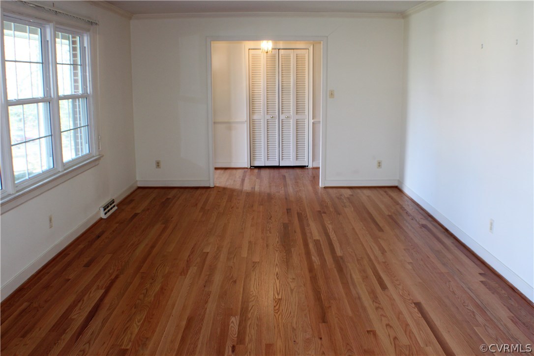 9931 Trebeck Road Chesterfield, VA 23236 - Photo 3 of 43 an empty room with wooden floor and windows