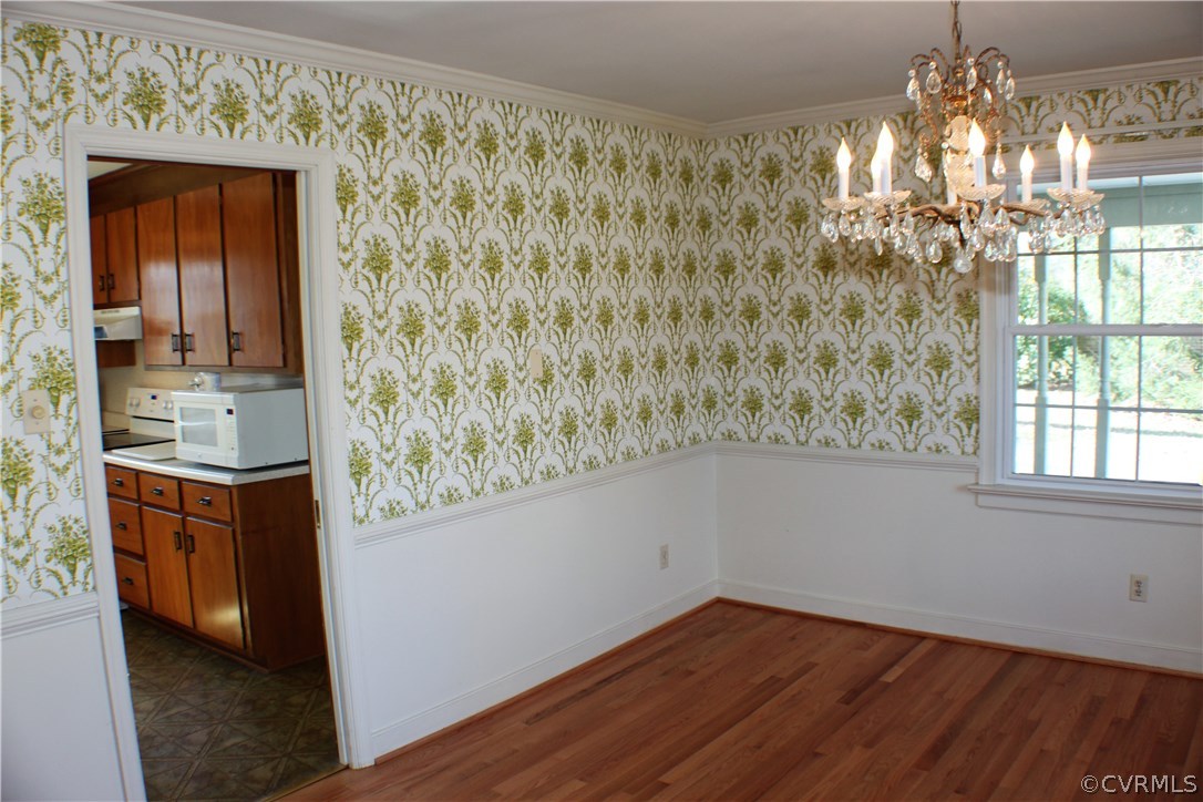 9931 Trebeck Road Chesterfield, VA 23236 - Photo 5 of 43 a view of hallway with chandelier and wooden floor