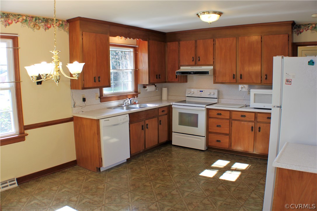 9931 Trebeck Road Chesterfield, VA 23236 - Photo 7 of 43 a kitchen with a sink cabinets and wooden floor