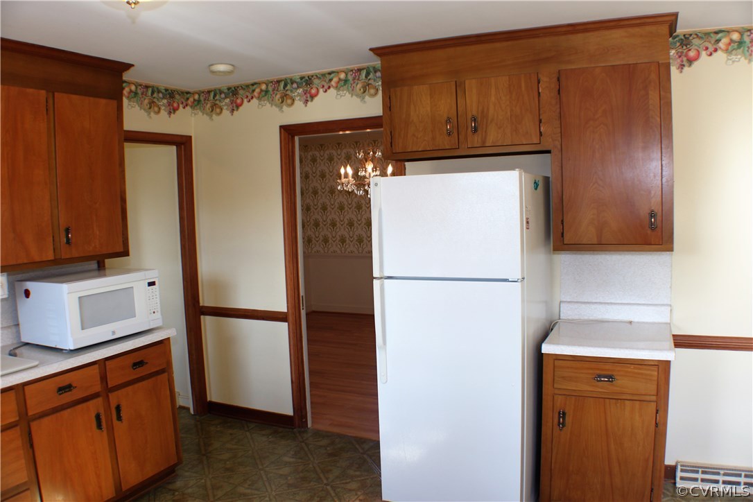 9931 Trebeck Road Chesterfield, VA 23236 - Photo 8 of 43 a kitchen with stainless steel appliances granite countertop a refrigerator and a cabinets