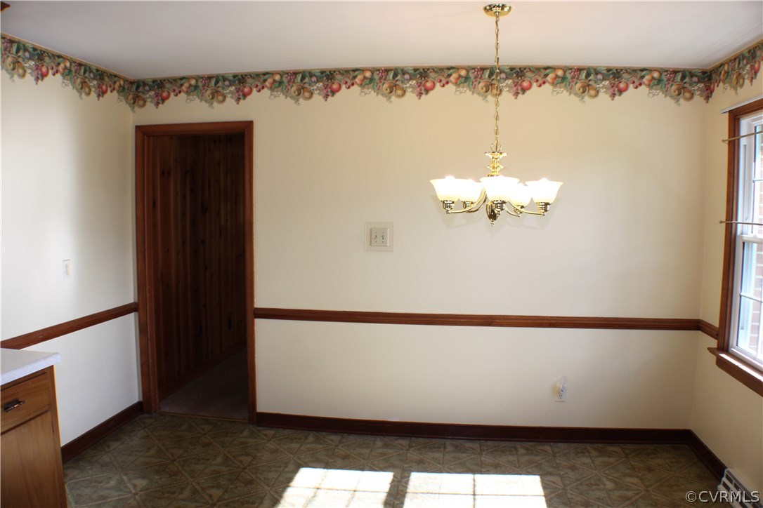9931 Trebeck Road Chesterfield, VA 23236 - Photo 9 of 43 a view of a chandelier in an empty room