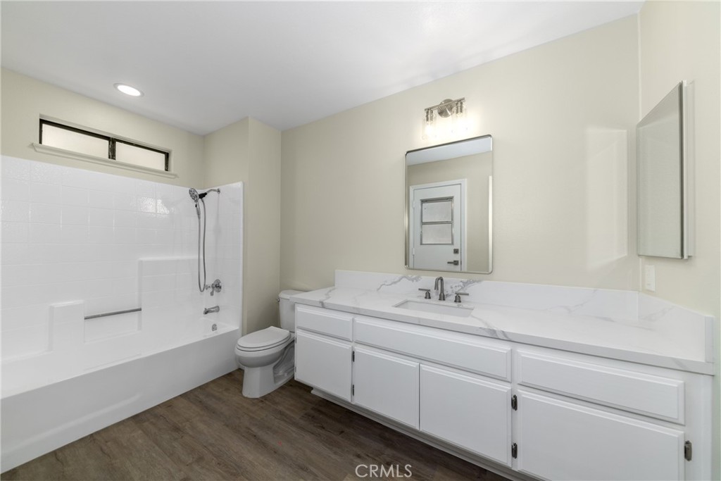 32465 Cape Cod Drive Lake Elsinore, CA 92530 - Photo 15 of 29 a bathroom with a sink a toilet and shower