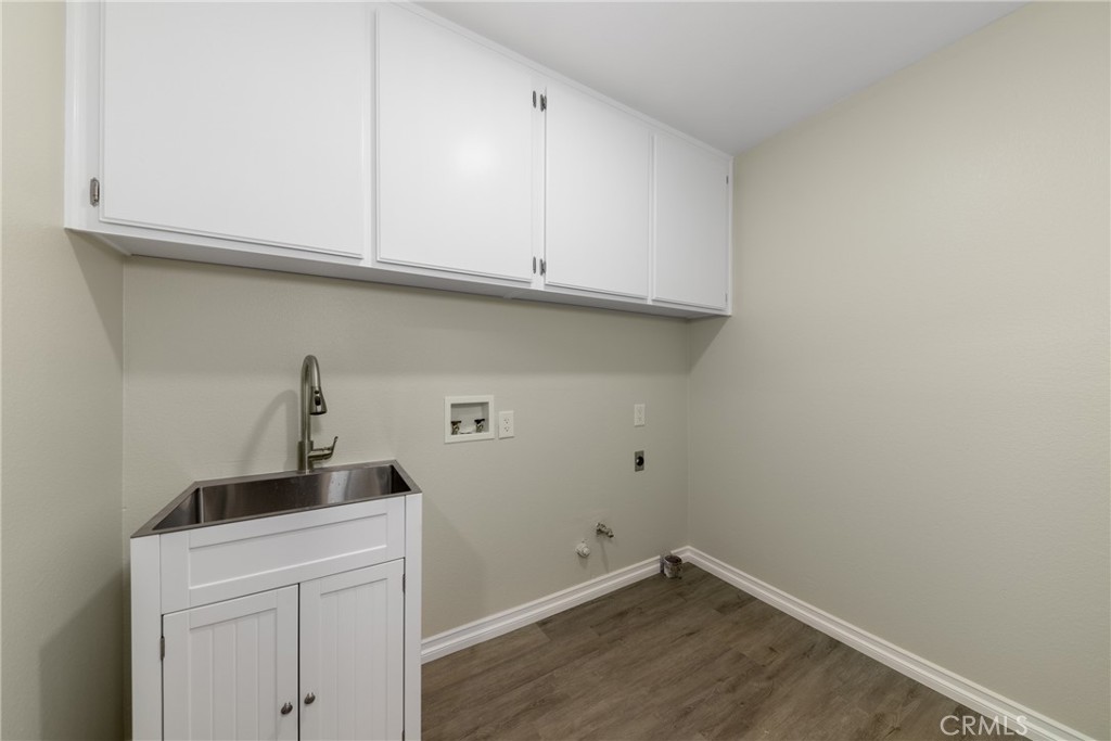 32465 Cape Cod Drive Lake Elsinore, CA 92530 - Photo 16 of 29 a view of storage and utility room with washer and dryer