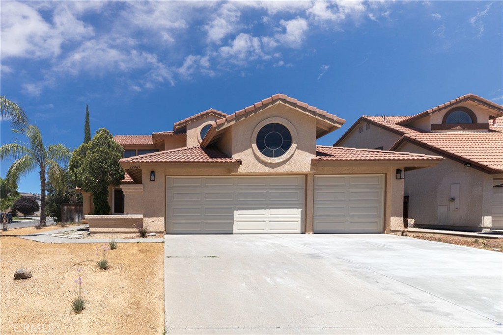 32465 Cape Cod Drive Lake Elsinore, CA 92530 - Photo 2 of 29 a view of a house with backyard and parking space