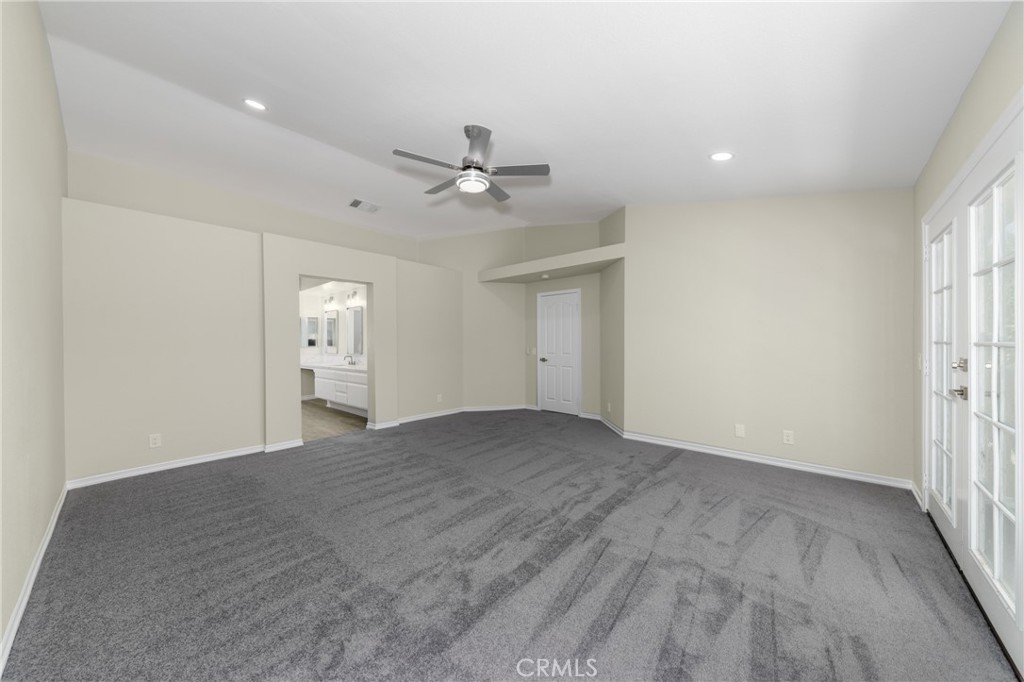 32465 Cape Cod Drive Lake Elsinore, CA 92530 - Photo 22 of 29 wooden floor in an empty room with a window