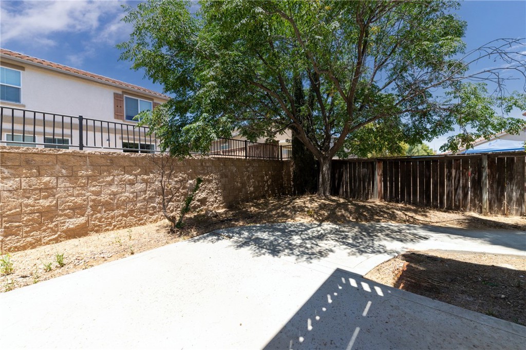 32465 Cape Cod Drive Lake Elsinore, CA 92530 - Photo 29 of 29 a view of a backyard with tree