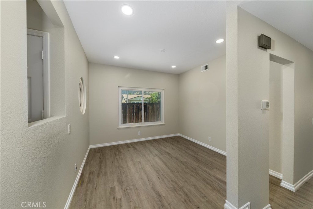32465 Cape Cod Drive Lake Elsinore, CA 92530 - Photo 6 of 29 a view of room with window and hardwood floor