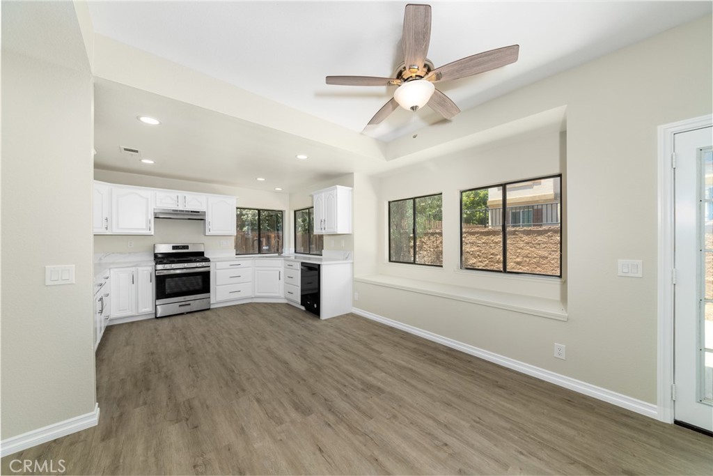 32465 Cape Cod Drive Lake Elsinore, CA 92530 - Photo 9 of 29 a view of an empty room with a kitchen