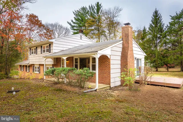 a aerial view of residential houses with yard