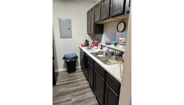 a kitchen with a sink and a stove