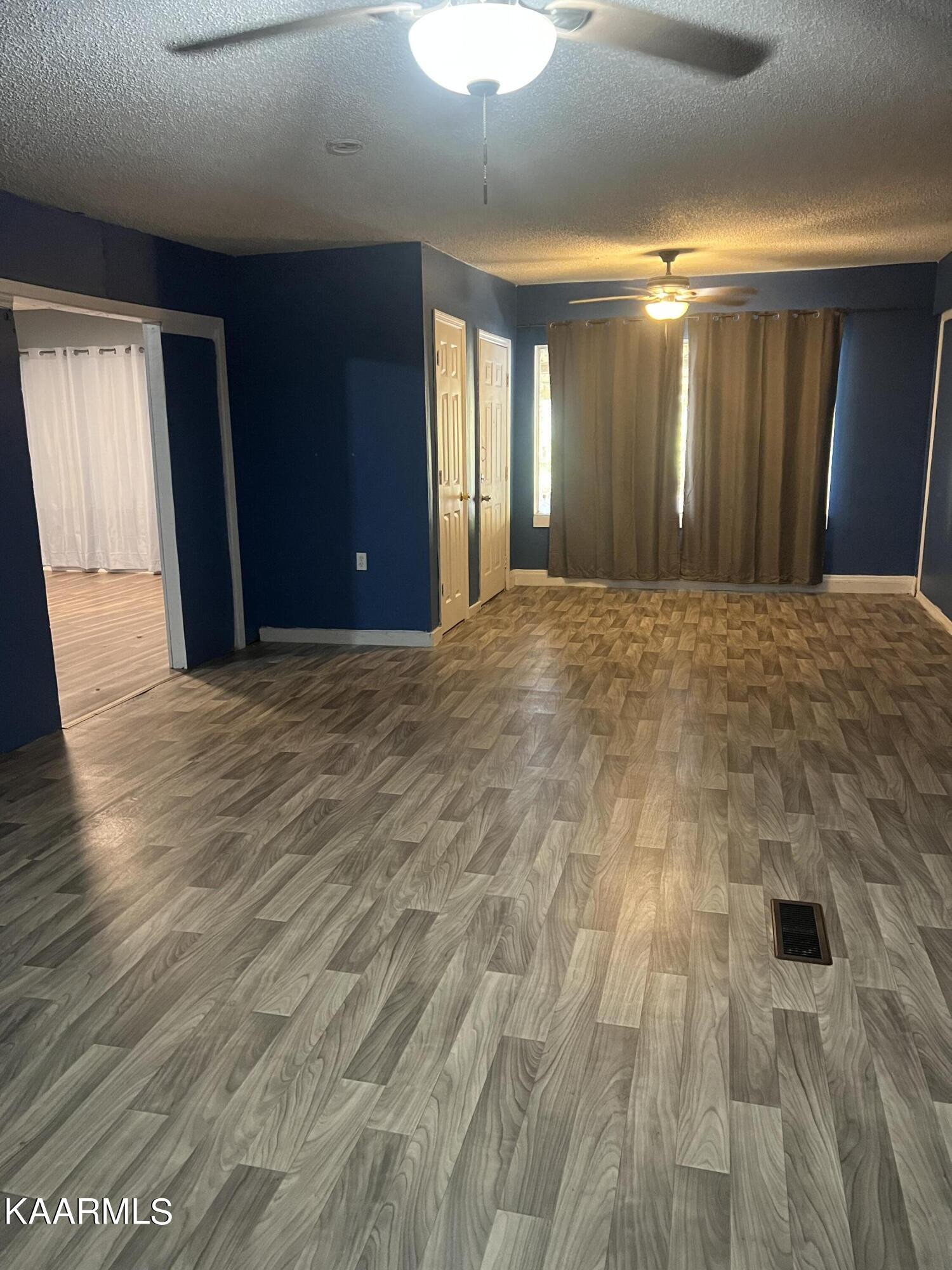542 Sweetwater Road Philadelphia, TN 37846 - Photo 2 of 6 a view of an empty room with wooden floor