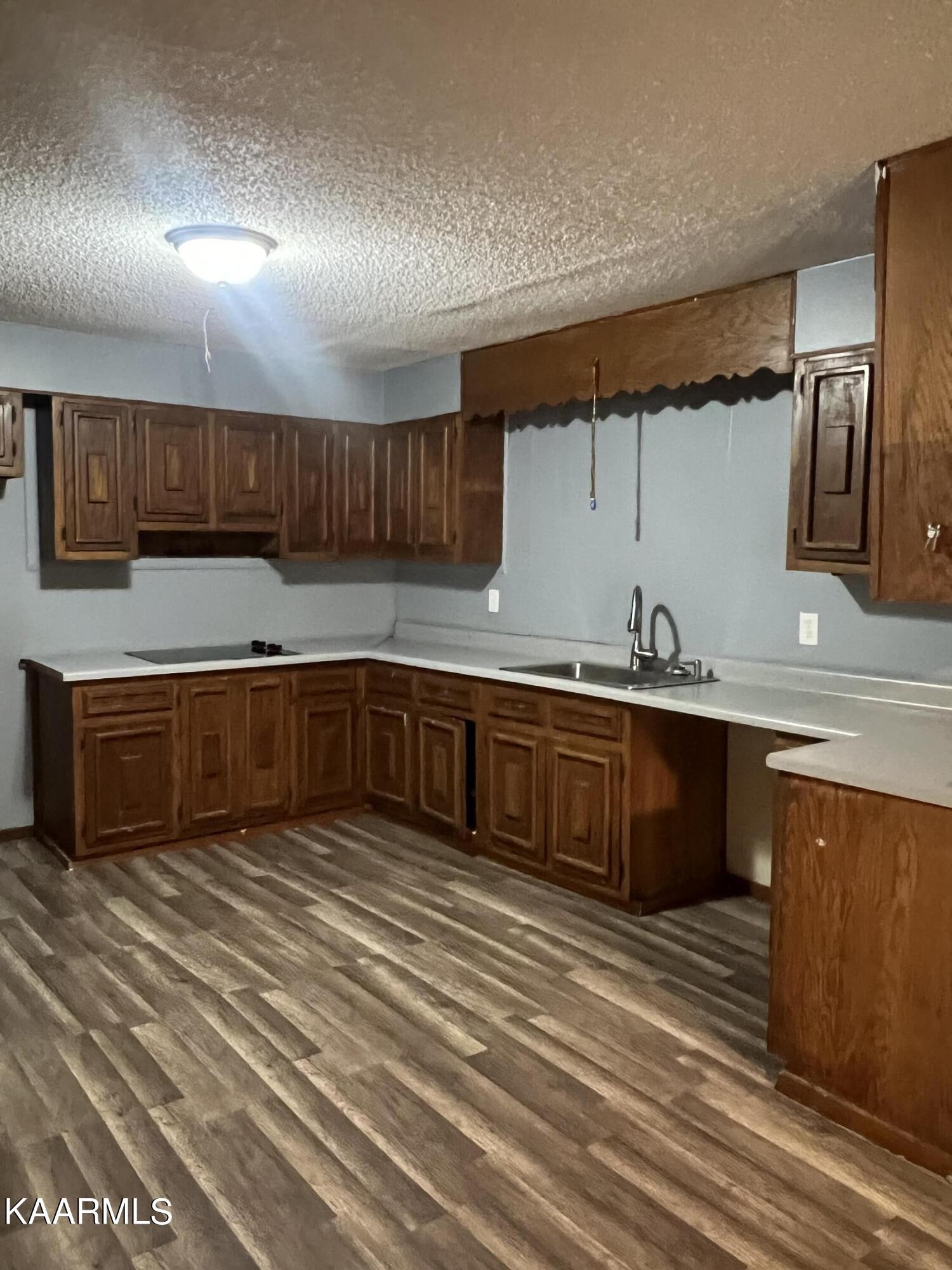542 Sweetwater Road Philadelphia, TN 37846 - Photo 3 of 6 a kitchen with stainless steel appliances granite countertop a sink and cabinets