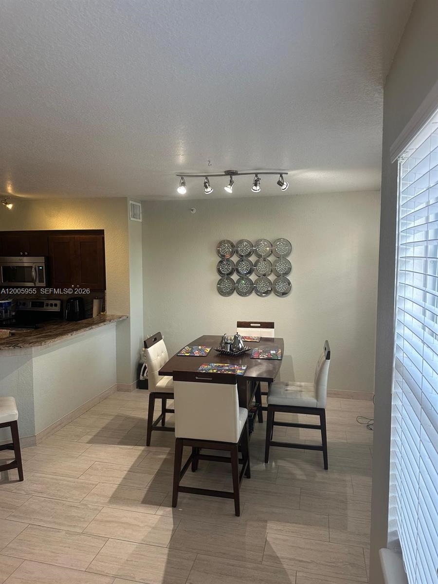 6920 West Sample Road, Unit 6920 Pompano Beach, FL 33063 - Photo 19 of 30 a view of a workspace with furniture