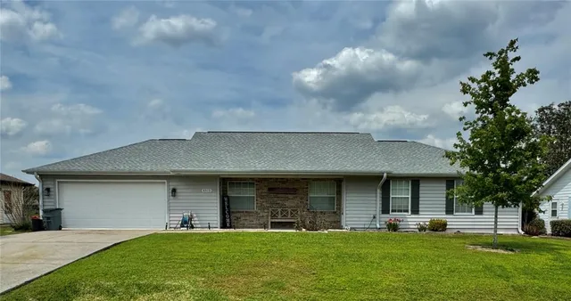 a view of a yard of front a house