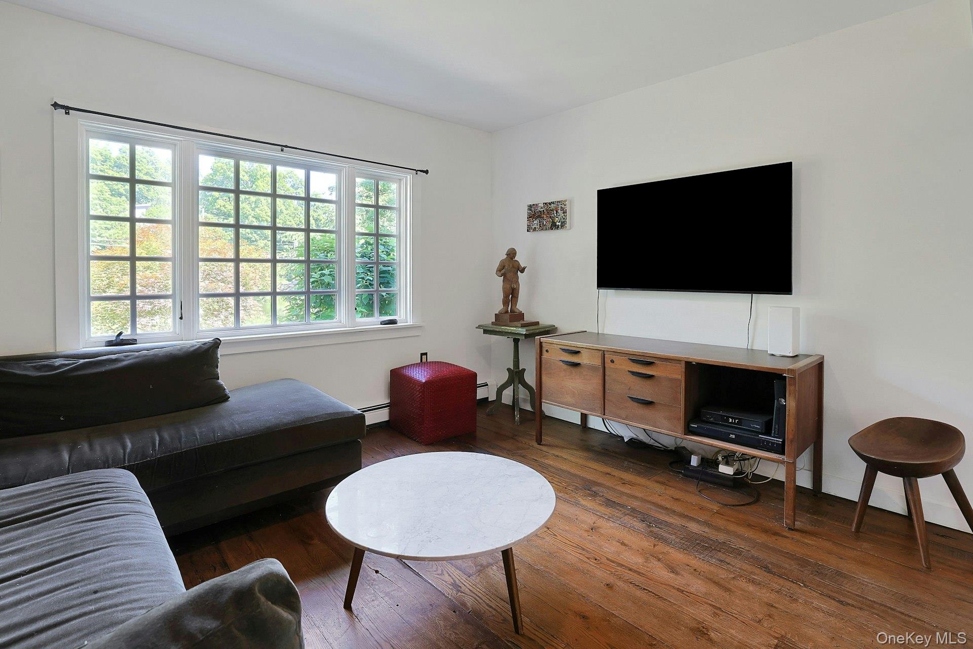 65 Douglas Road Chappaqua, NY 10514 - Photo 11 of 41 Easy comfort and connection can happen in this light-filled family room.