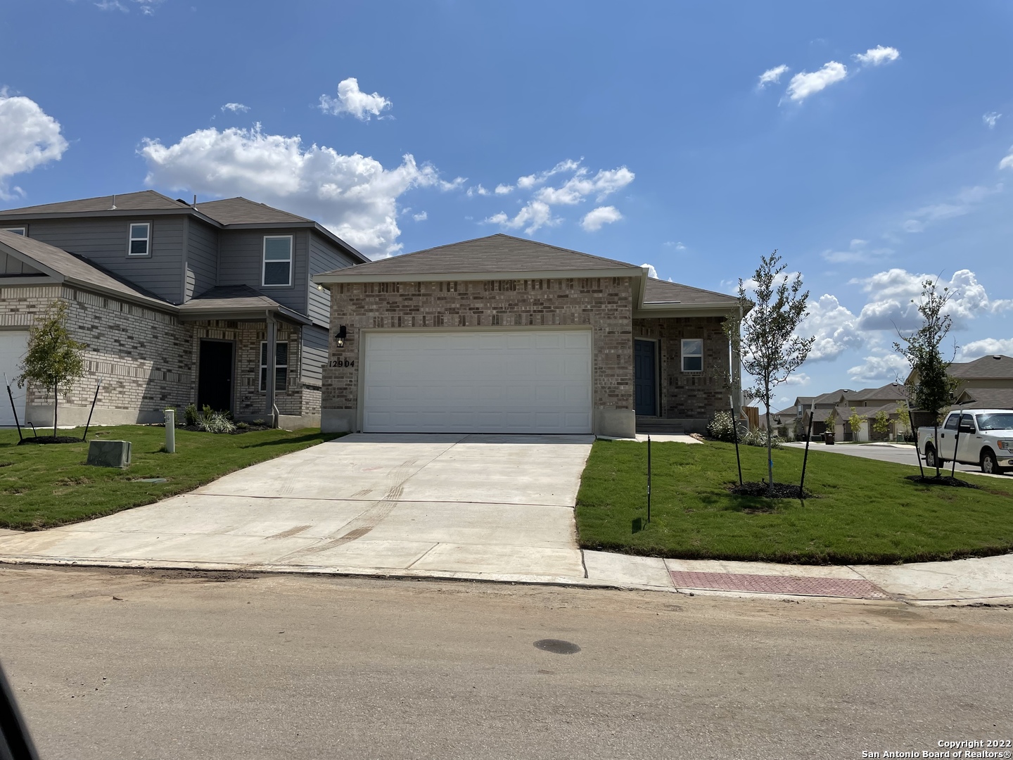 12904 Candace Way St. Hedwig, TX 78152 - Photo 1 of 15 a front view of a house with a yard and garage
