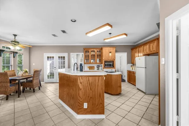 a kitchen with stainless steel appliances granite countertop a stove and a refrigerator