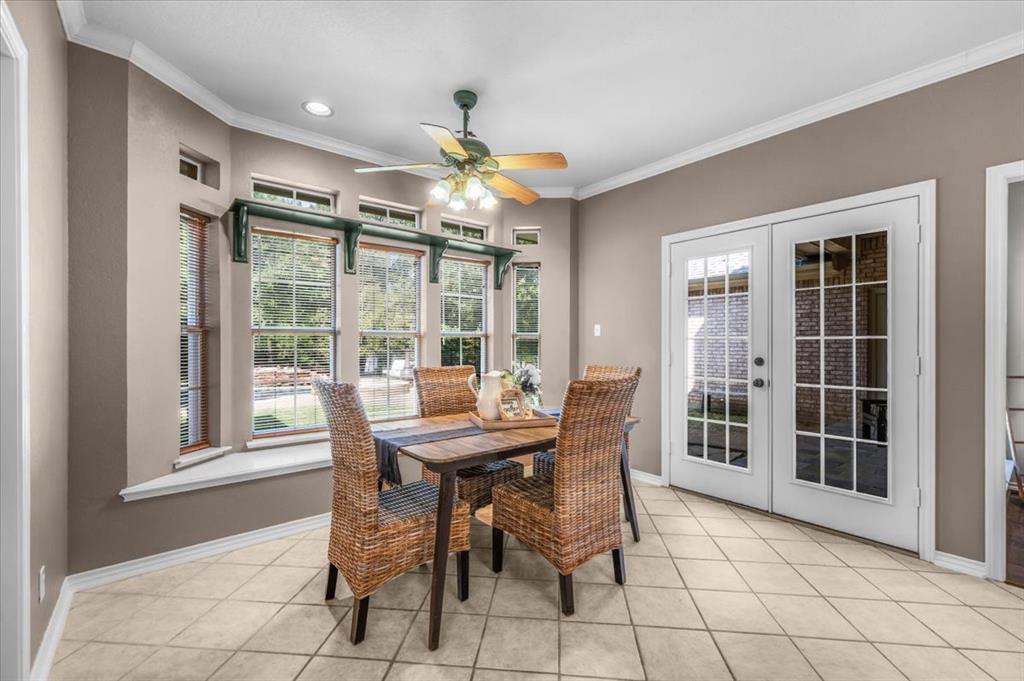 910 Crystal Cove Oak Point, TX 75068 - Photo 17 of 40 a view of a dining room with furniture window and outside view