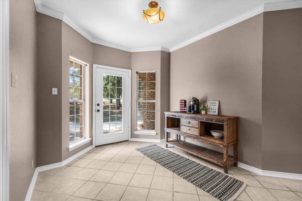 910 Crystal Cove Oak Point, TX 75068 - Photo 18 of 40 a bedroom with a bed and a window