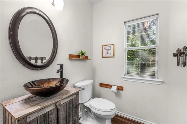 a bed room with a bed and a ceiling fan