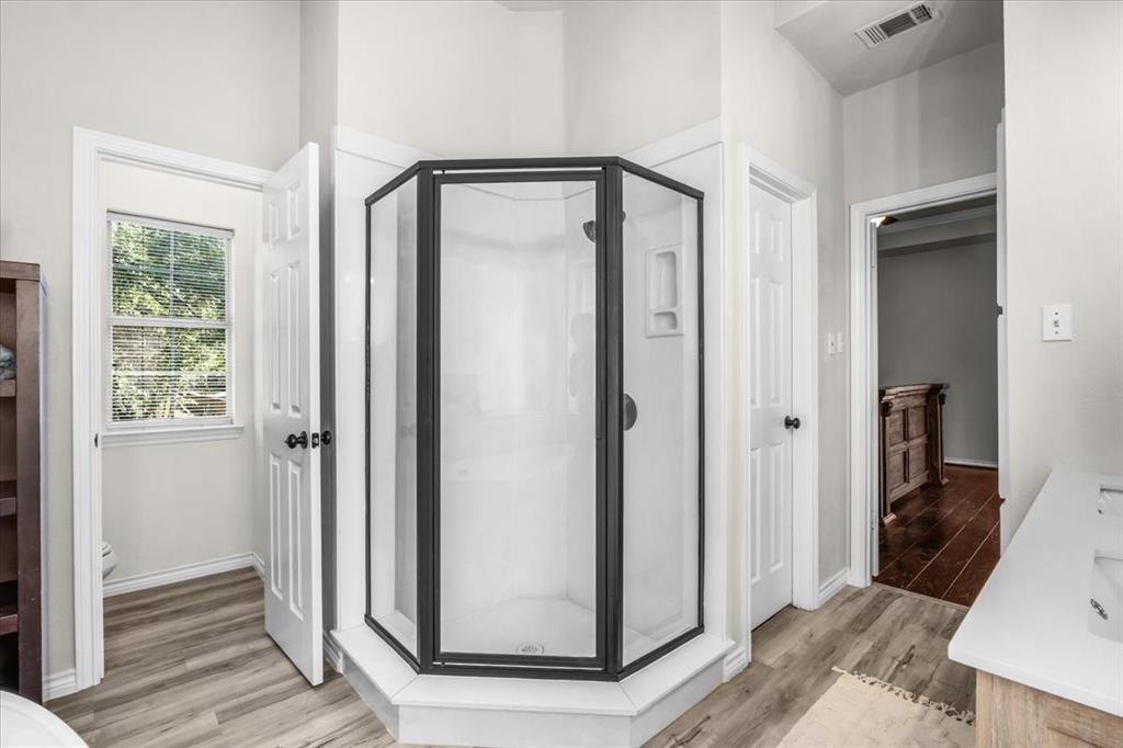 910 Crystal Cove Oak Point, TX 75068 - Photo 24 of 40 a view of a bathroom with mirror