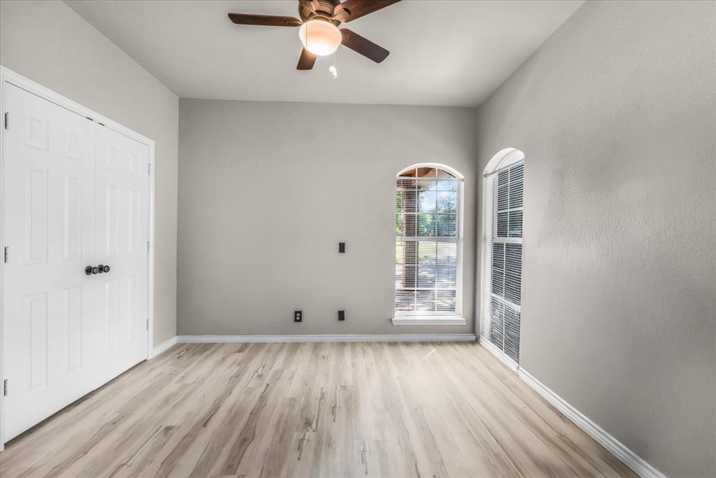 910 Crystal Cove Oak Point, TX 75068 - Photo 26 of 40 wooden floor in an empty room with a window