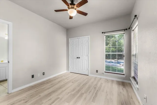 a bathroom with a double vanity sink toilet mirror and bathtub