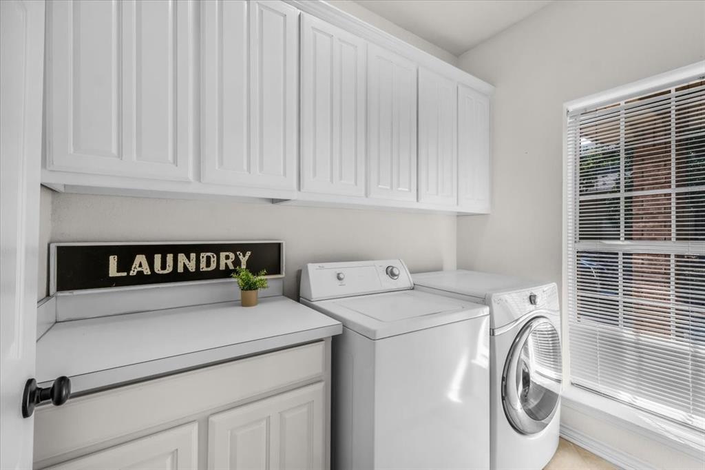 910 Crystal Cove Oak Point, TX 75068 - Photo 30 of 40 a utility room with dryer and washer