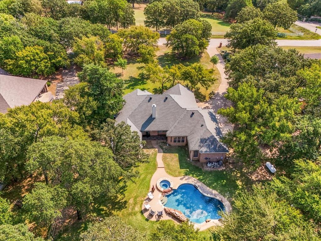 910 Crystal Cove Oak Point, TX 75068 - Photo 3 of 40 an aerial view of a house with swimming pool and garden view