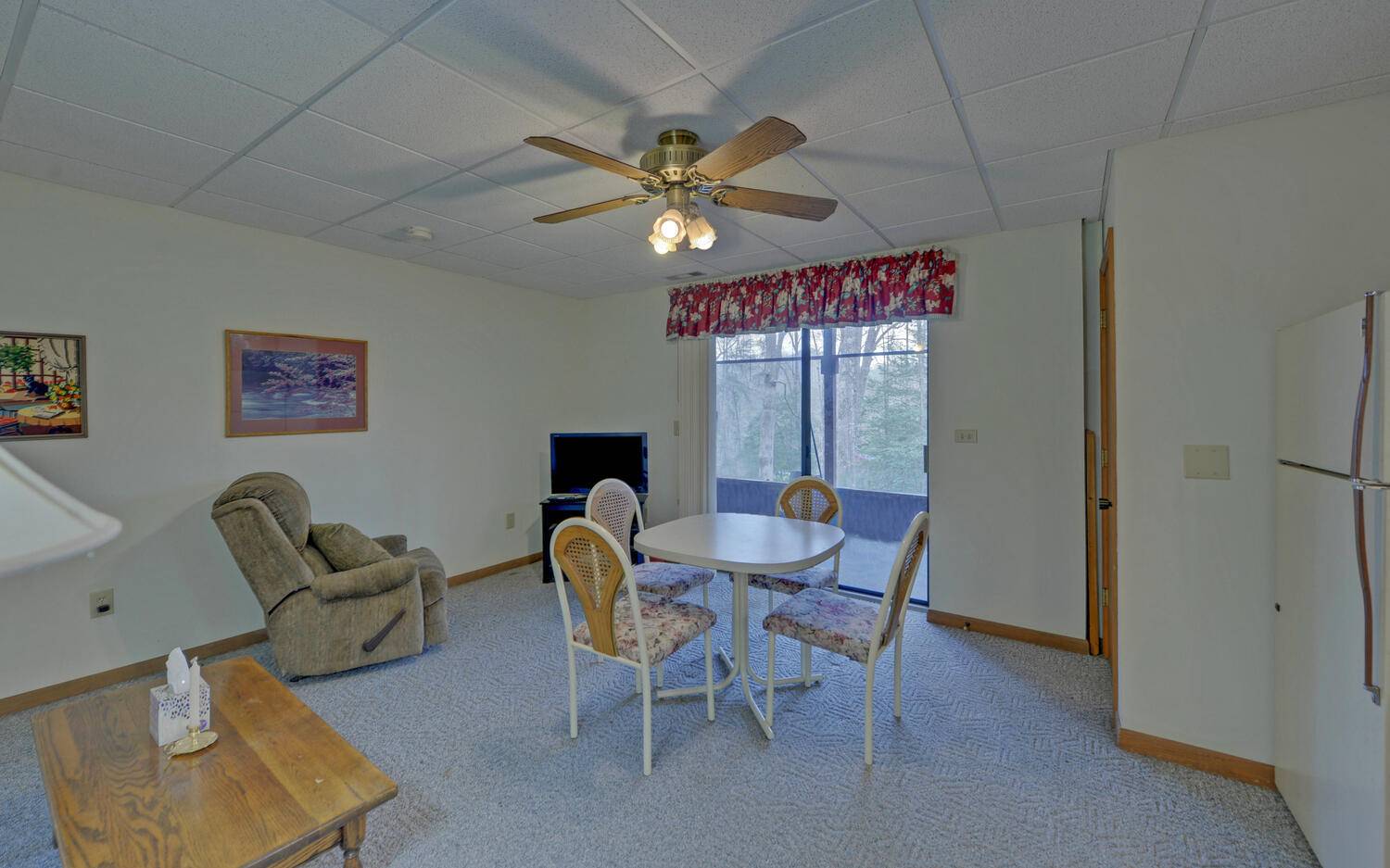 2139 Lake Louisa Road Hiawassee, GA 30546 - Photo 16 of 48 a view of a livingroom with furniture and a chandelier fan