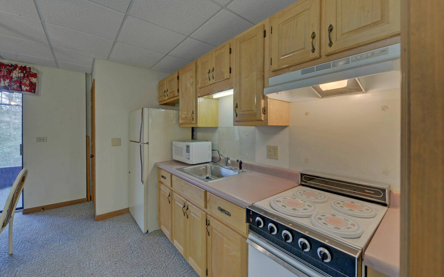 2139 Lake Louisa Road Hiawassee, GA 30546 - Photo 17 of 48 a kitchen with stainless steel appliances granite countertop a stove and a refrigerator