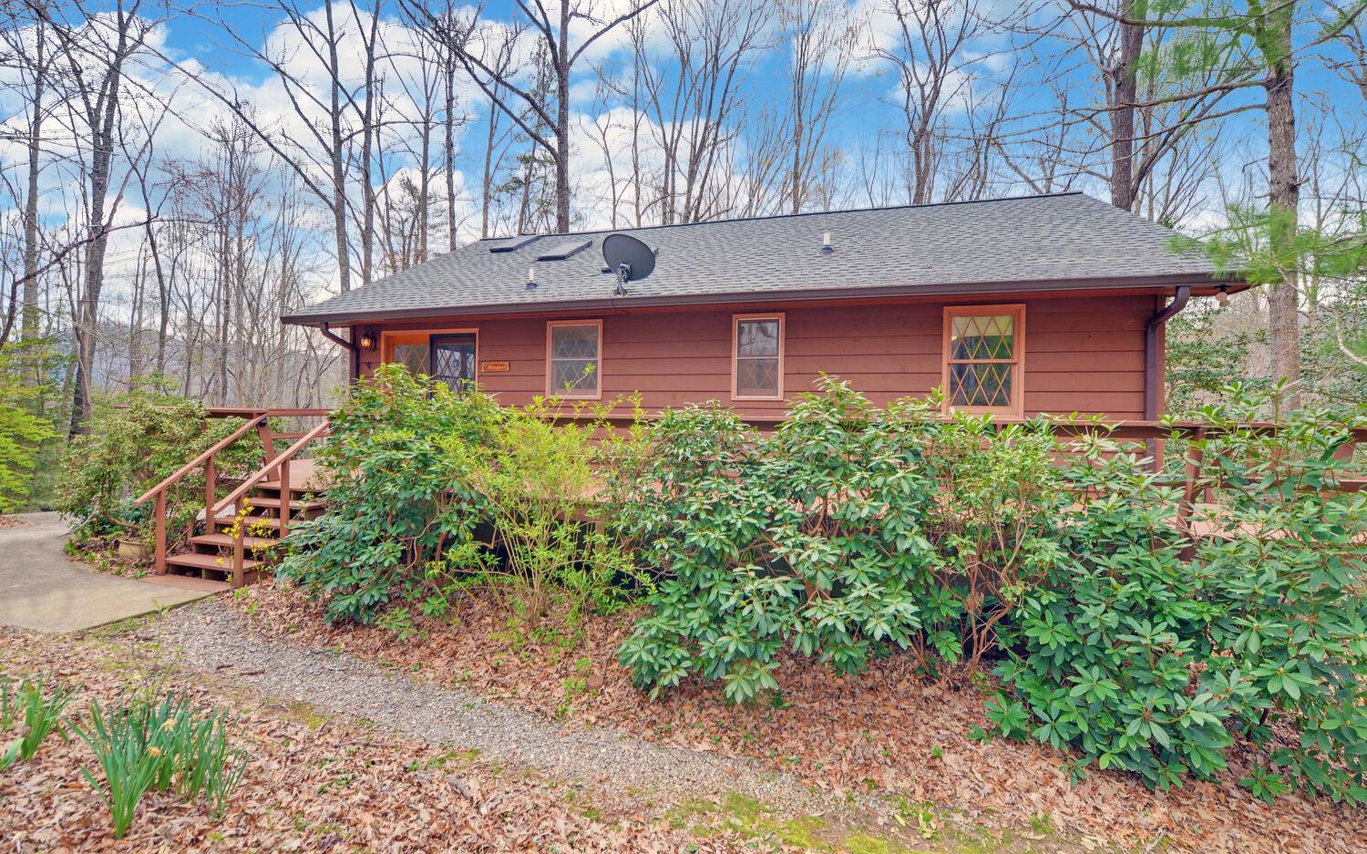 2139 Lake Louisa Road Hiawassee, GA 30546 - Photo 2 of 48 a front view of a house with garden