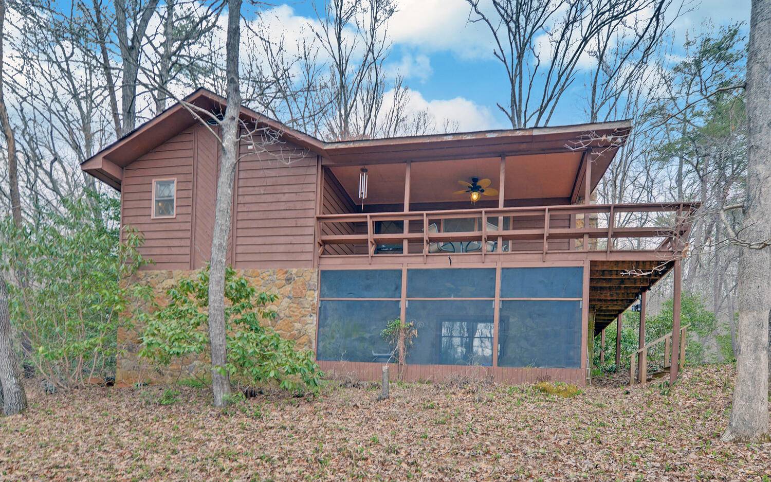 2139 Lake Louisa Road Hiawassee, GA 30546 - Photo 3 of 48 a front view of a house with garden
