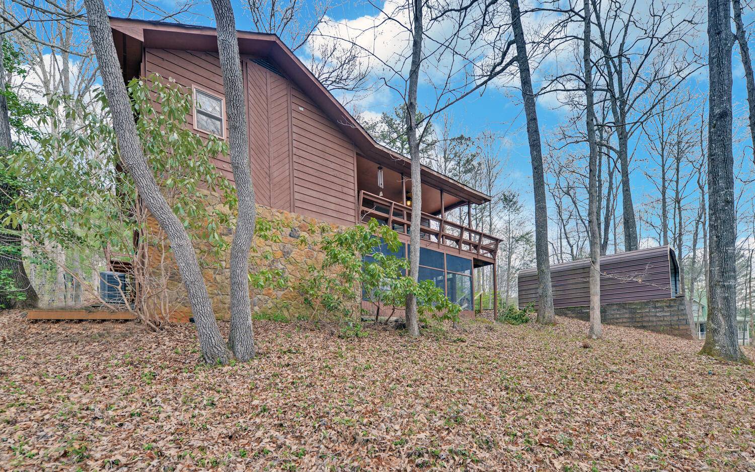 2139 Lake Louisa Road Hiawassee, GA 30546 - Photo 36 of 48 a backyard of a house with lots of green space