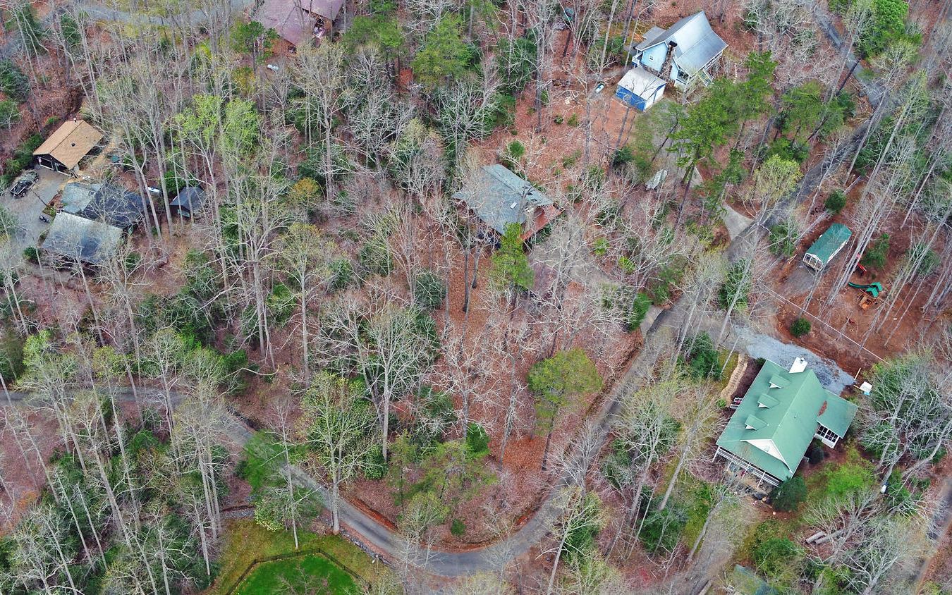 2139 Lake Louisa Road Hiawassee, GA 30546 - Photo 40 of 48 a backyard of a house with lots of trees