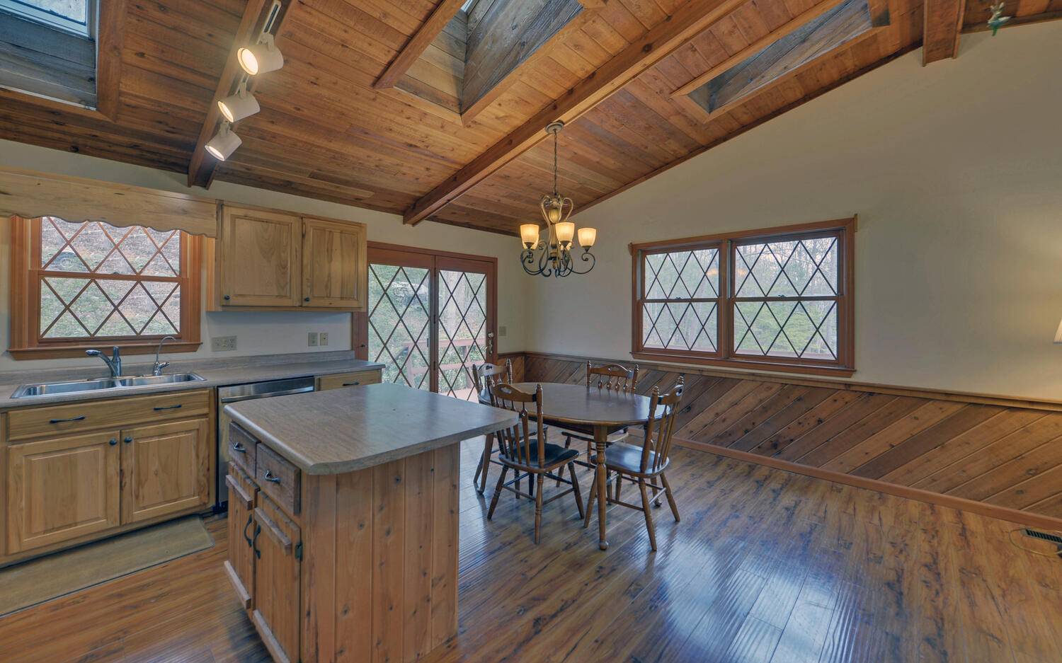 2139 Lake Louisa Road Hiawassee, GA 30546 - Photo 8 of 48 a kitchen with sink cabinets and wooden floor