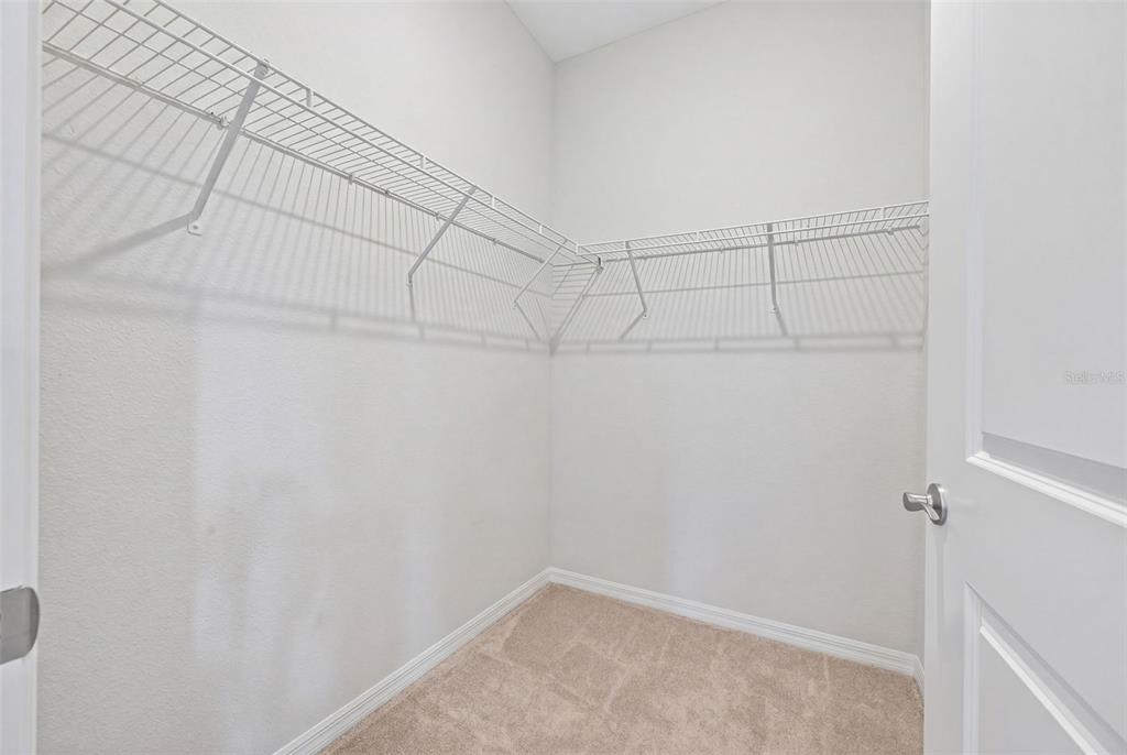 18237 Beach Ranch Terrace Bradenton, FL 34211 - Photo 43 of 72 a view of a room with racks on the wall