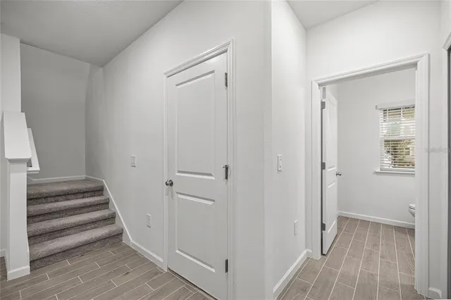 an empty room with a empty space and a ceiling fan