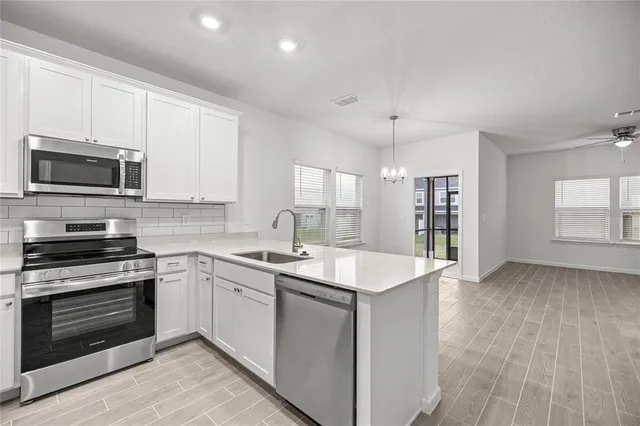 a bathroom with a sink a toilet and a bathtub
