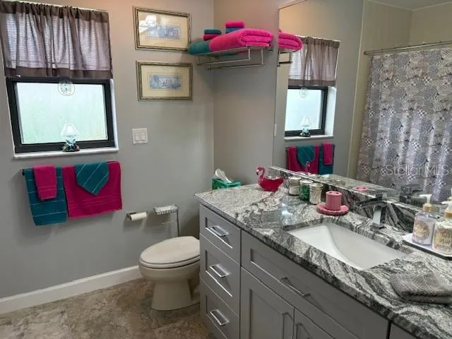 an aerial view of residential building with parking