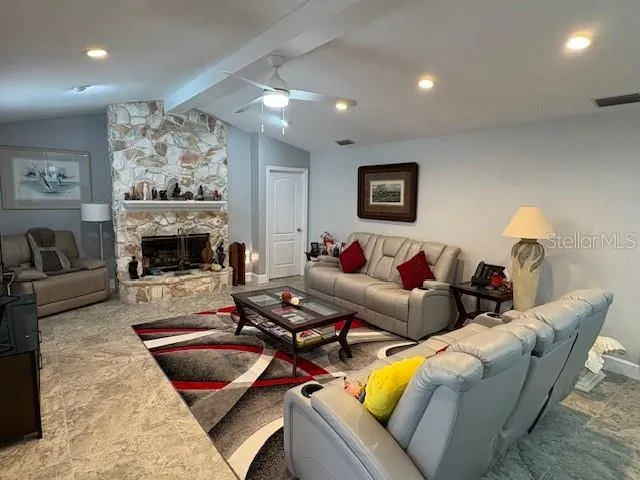 a bathroom with a granite countertop sink and a toilet