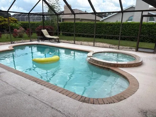 a kitchen with stainless steel appliances granite countertop a refrigerator and a stove
