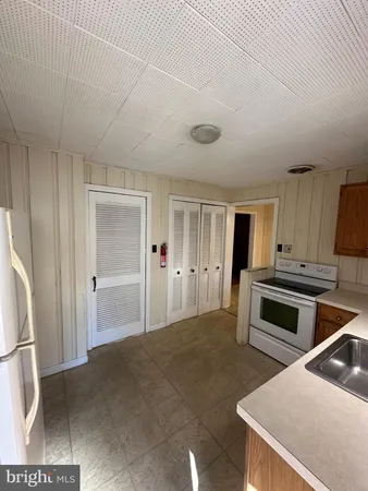 a kitchen with a stove and a refrigerator